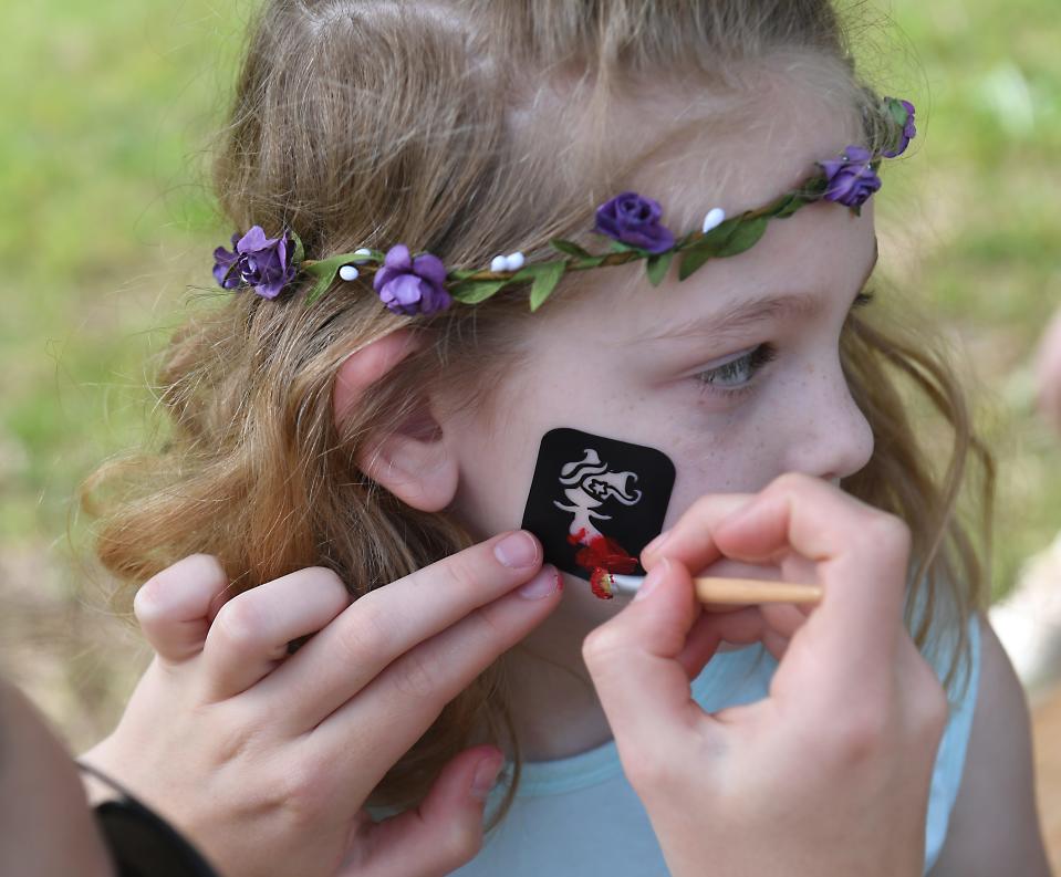 Spartanburg Area Conservancy (SPACE) 35th Earth Day Birthday Bash was held at the Glendale Shoals Preserve in Spartanburg on April 20, 2024. Mom, Jessica Stevens of Boiling Springs, stood by as her daughter, Georgia Kate, 6, here, got her face painted at the event.