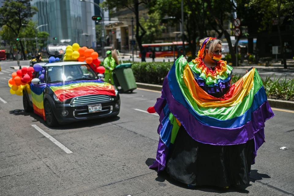 <p>Revellers partake in a substitute march in Mexico City. </p>