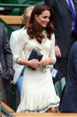 <p>Kate wore a knitted sailor dress by Alexander McQueen to Wimbledon. She carried a quilted Jaeger bag to finish off the look.</p><p><i>[Photo: PA]</i></p>