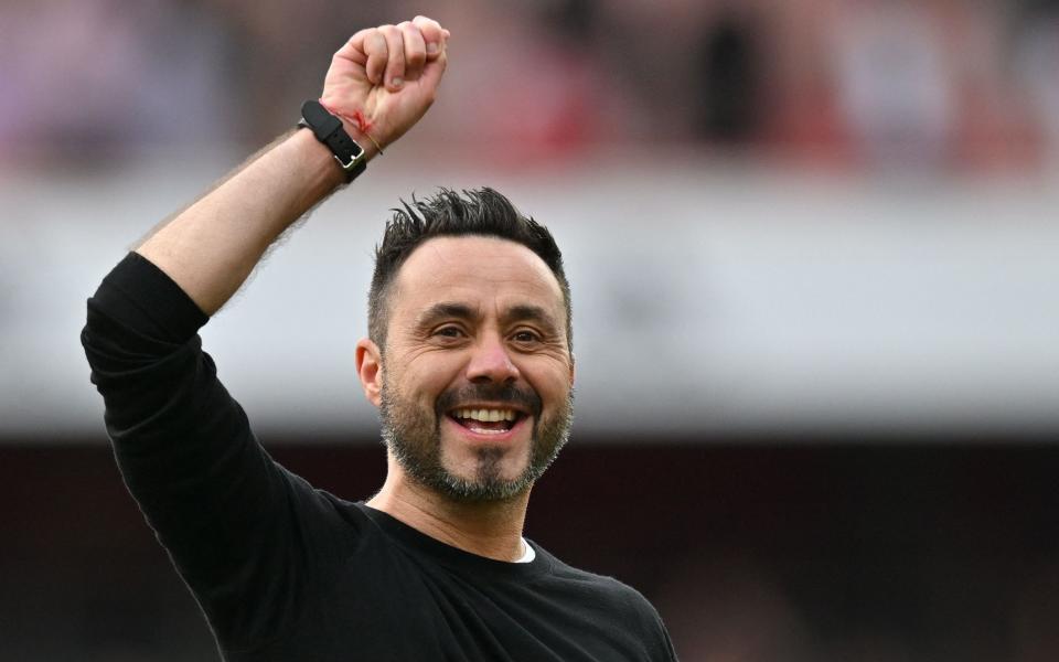 Brighton's Italian head coach Roberto De Zerbi celebrates at the end of the English Premier League football match between Arsenal and Brighton and Hove Albion at the Emirates Stadium in London on May 14, 2023. Brighton beat Arsenal 3-0