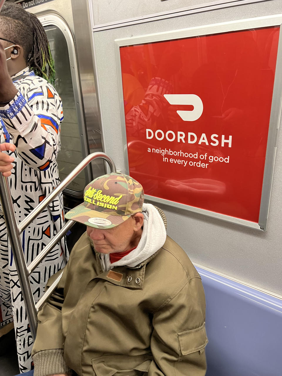 Ads for DoorDash on the New York City subway promise “a neighborhood of good in every order” — though not a neighborhood of good taste when it comes to what people wear as they dash to their own doors to accept their food. (Thomas P. Farley)