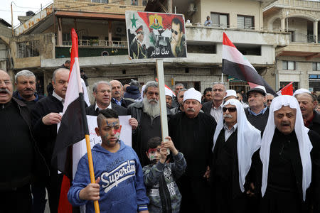 Druze people take part in a rally over U.S. President Donald Trump's support for Israeli sovereignty over the Golan Heights, in Majdal Shams near the ceasefire line between Israel and Syria in the Israeli occupied Golan Heights March 23, 2019 REUTERS/Ammar Awad