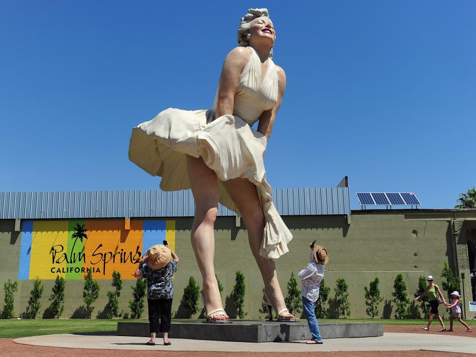 People visit and photograph the ‘Forever Marilyn’ statue of actress Marilyn Monroe in Palm Springs, California, on 4 August 2012AFP via Getty Images