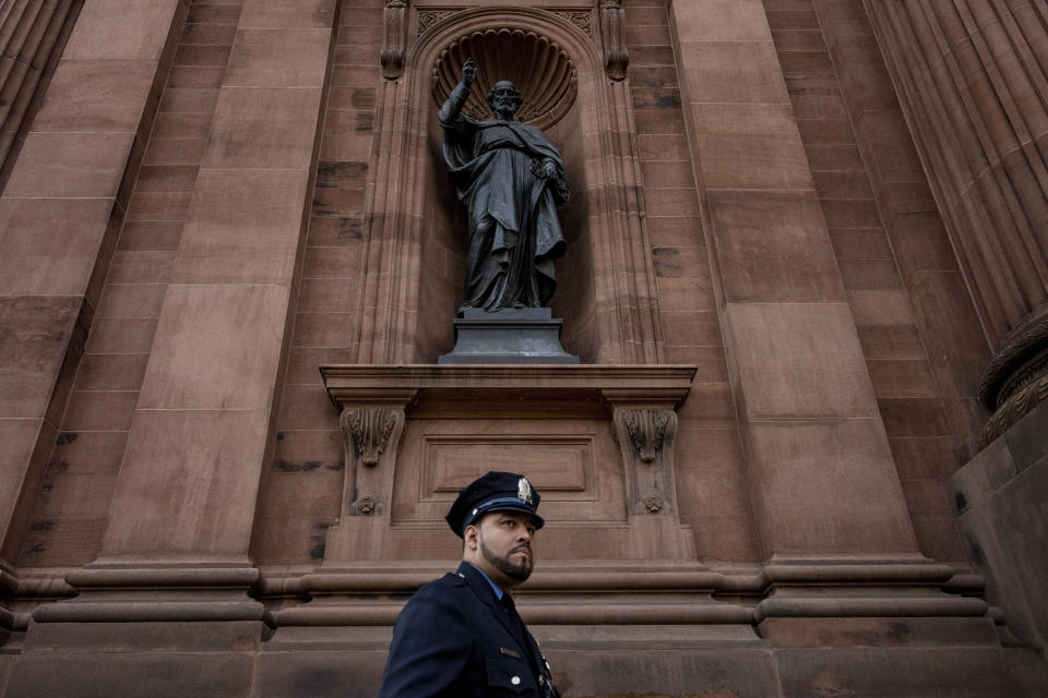 Law enforcement officers gather for a viewing for officer Richard Mendez at the Cathedral Basilica of Saints Peter and Paul in Philadelphia, Tuesday, Oct. 24, 2023. Mendez was shot and killed, and a second officer was wounded when they confronted people breaking into a car at Philadelphia International Airport, Oct. 12, police said. (AP Photo/Joe Lamberti)