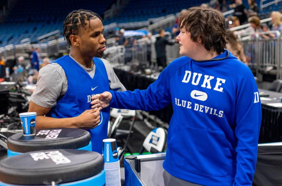 Duke fan Landon Cornwell of Tallahassee, Fla. talks with Jeremy Roach (3) following the Blue Devils’ practice on Wednesday, March 15, 2023 at the Amway Center in Orlando, Fla. Duke will open NCAA tournament play against Oral Roberts.