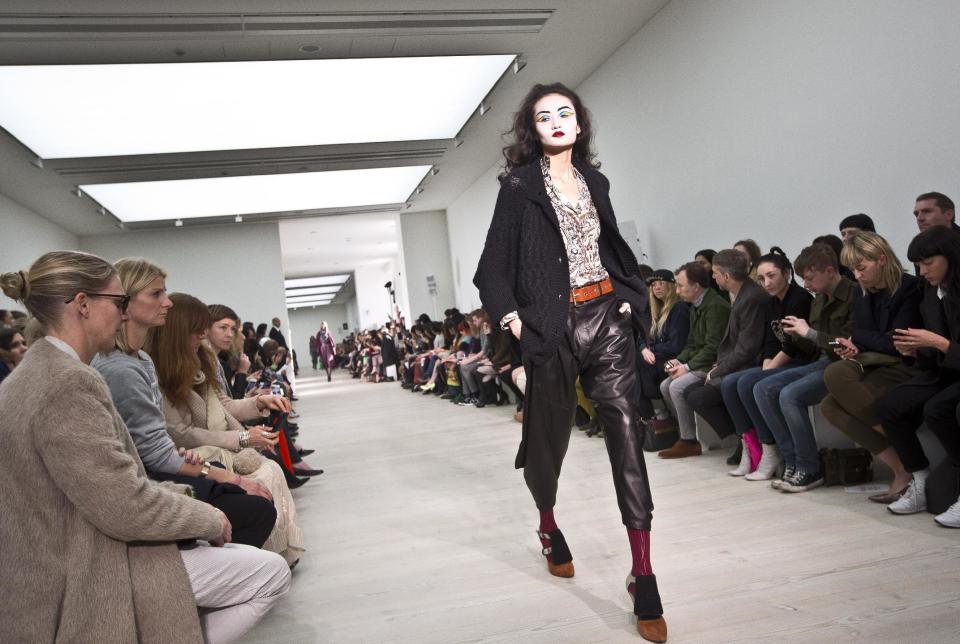 A model wears a design created by Vivienne Westwood during London Fashion Week, at the Saatchi Gallery in West London, Sunday, Feb. 17, 2013. (Photo by Joel Ryan/Invision/AP)