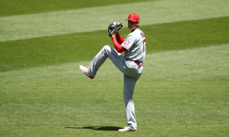 Shohei Ohtani warms up in the outfield before a game for the Angels.
