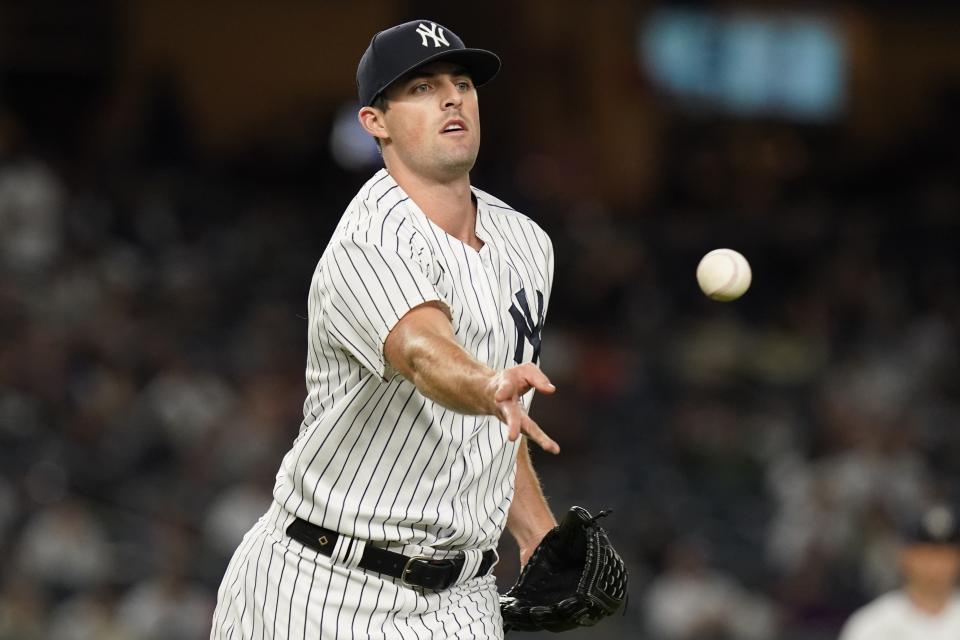 New York Yankees relief pitcher Clay Holmes throws out Texas Rangers' Leody Taveras at first base during the seventh inning of a baseball game Monday, Sept. 20, 2021, in New York. (AP Photo/Frank Franklin II)