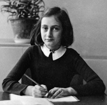 Anne Frank at her school desk in 1941.