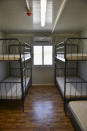 A view of a room inside the new multi-purpose reception and identification migrant centre which was constructed near Vathy town, on the eastern Aegean island of Samos, Greece, Saturday, Sept. 18, 2021. The centre constructed following a 121 million euros agreement between the European Commission and the Greek Ministry of Migration and Asylum, an amount granted to Greece for the construction of 3 reception centres on the islands of Samos, Kos, and Leros. (AP Photo/Michael Svarnias)