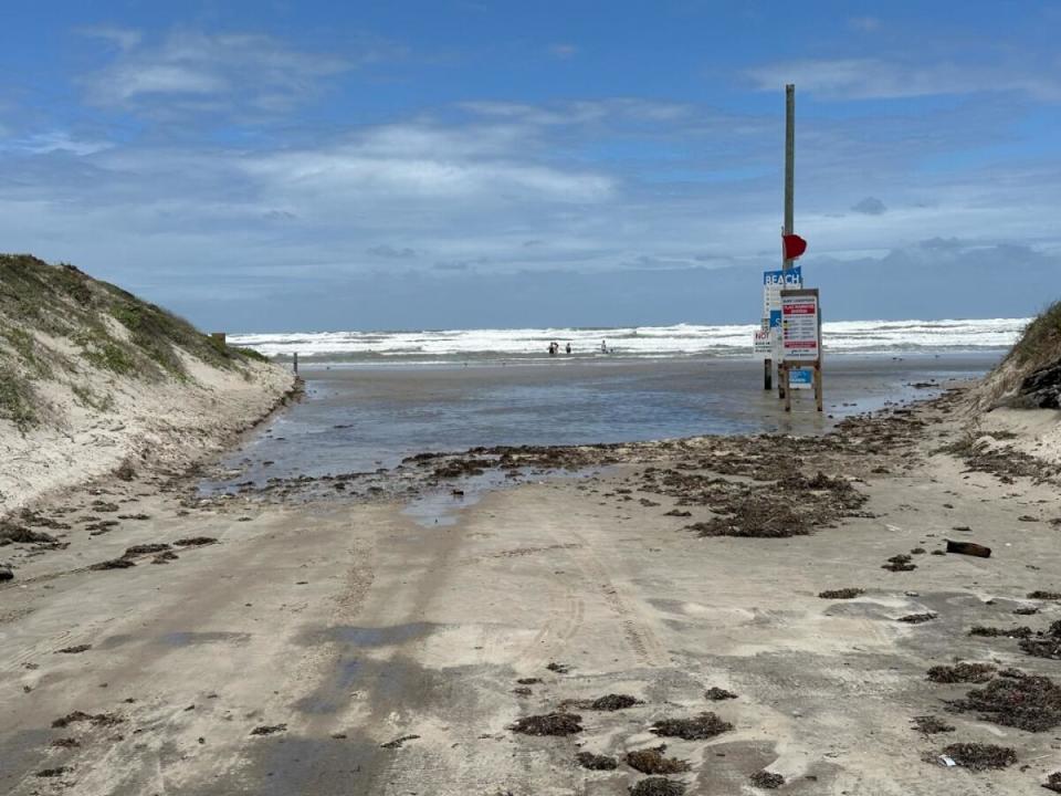 In this photo from the city of Corpus Christi, storm surge is shown beginning to encroach on beach access road Newport Pass.