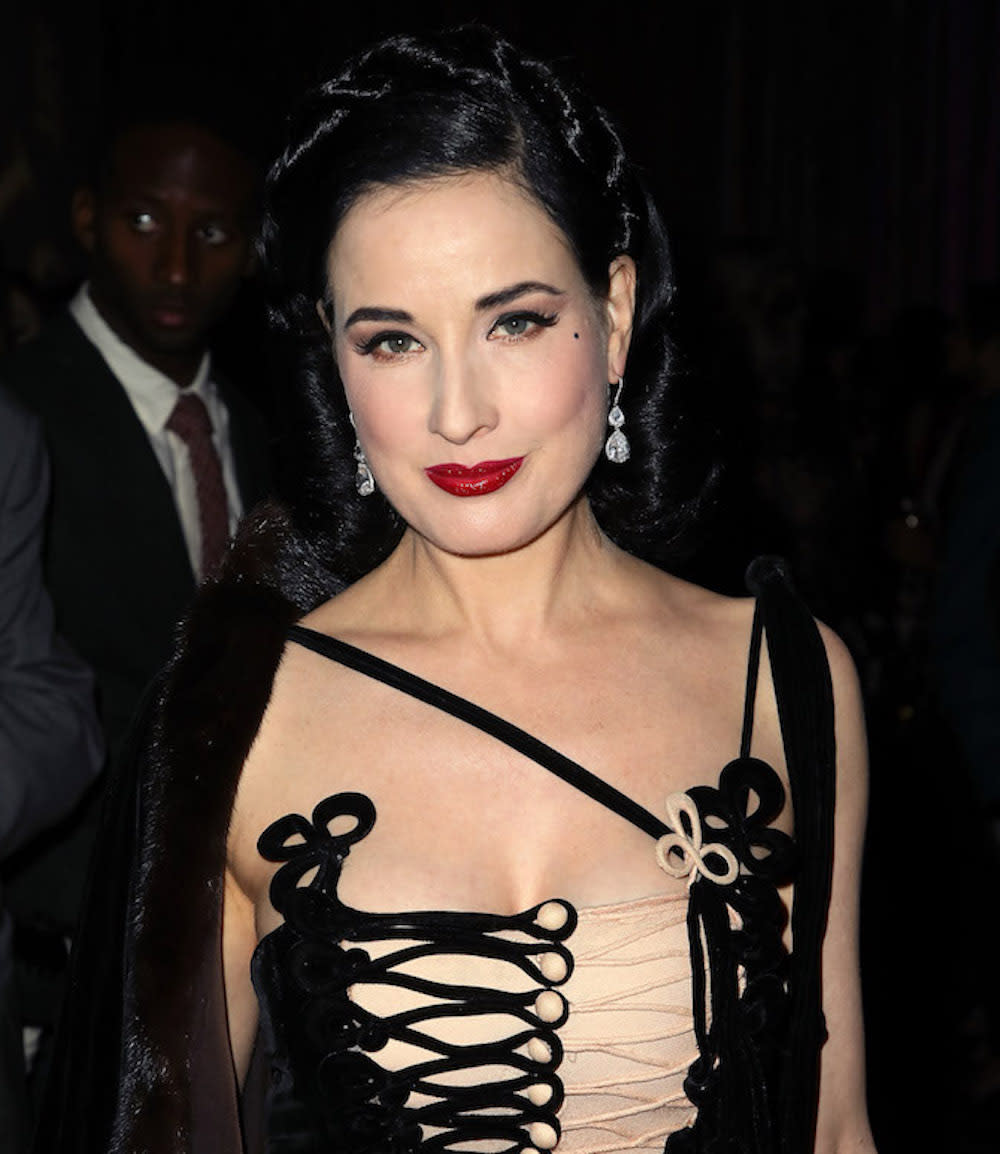 Dita Von Teese’s velvet corset dress is holiday party outfit #goals