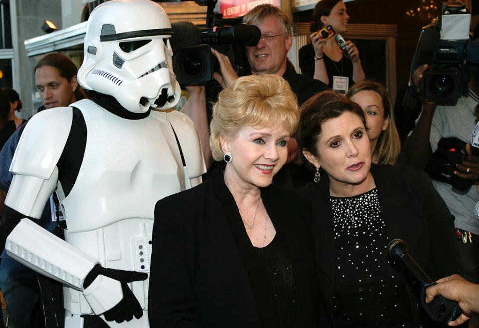 <p>Fisher brought her famous mom Debbie Reynolds to the premiere of <i>Star Wars: Episode III — Revenge of the Sith </i>in Washington, DC. Multiple premieres took place across the country on May 12, 2005 to benefit charity. (Photo: Shaun Heasley/Getty Images)</p>