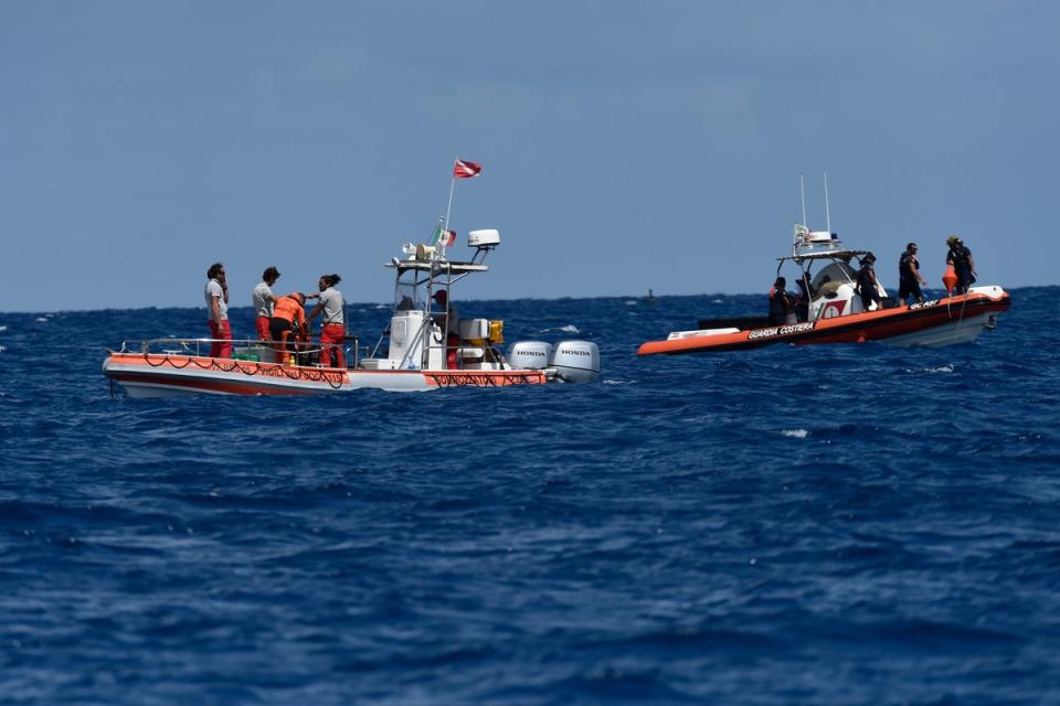 Scuba divers of the Italian Firefighters corp at the scene of the search for a missing boat, in Porticello, southern Italy (Copyright 2024 The Associated Press. All rights reserved)