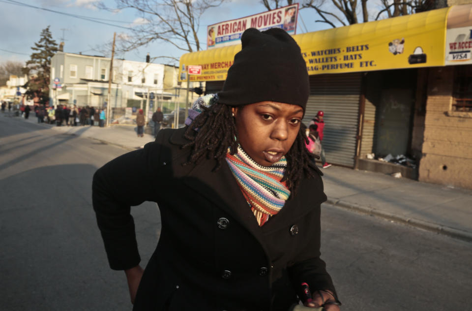 Naquasia LeGrand walks to catch a subway for work on Thursday Feb. 27, 2014 in the Carnarsie section of Brooklyn, N.Y. A few months ago, LeGrand was just another worker on the line at KFC, boxing up chicken and cole slaw in hopes of earning enough to live in one of the nation's most expensive cities. But since being recruited by union organizers, the 22-year-old from south Brooklyn has become one of the most visible faces of a national movement demanding $15-an-hour wages for fast-food workers. (AP Photo/Bebeto Matthews)