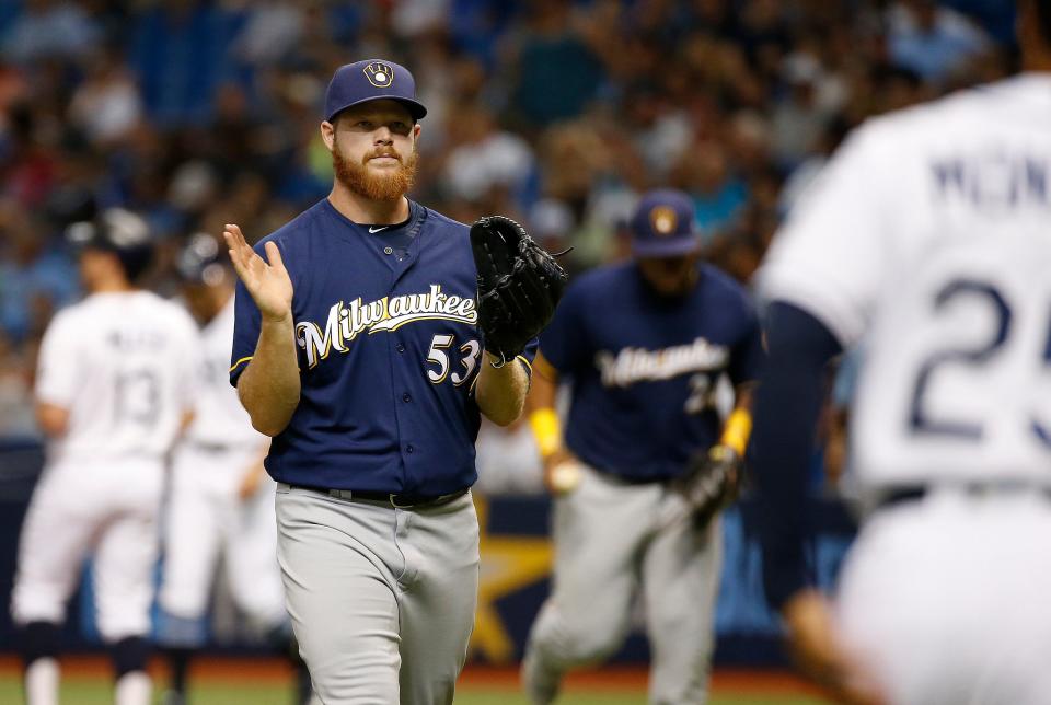 Milwaukee Brewers starting pitcher Brandon Woodruff (53) reacts as he walks back to the dugout as he left bases loaded during the first inning against the Tampa Bay Rays at Tropicana Field.