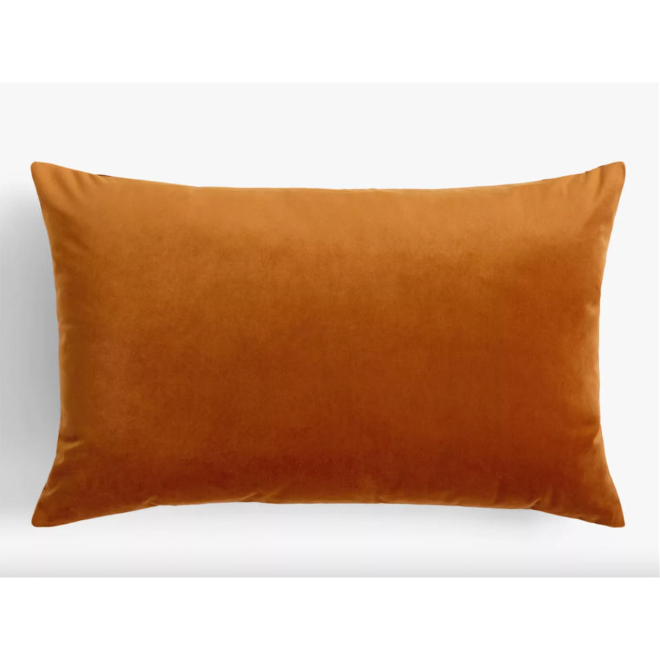 Caramel velvet oblong cushion on white background