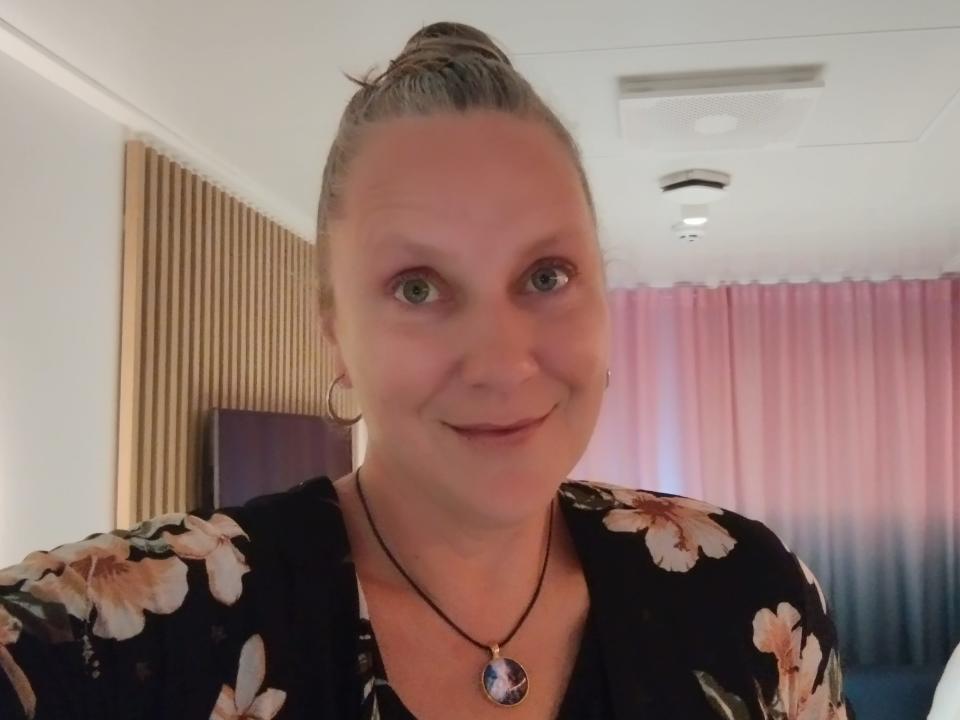 A woman in a cruise ship stateroom.