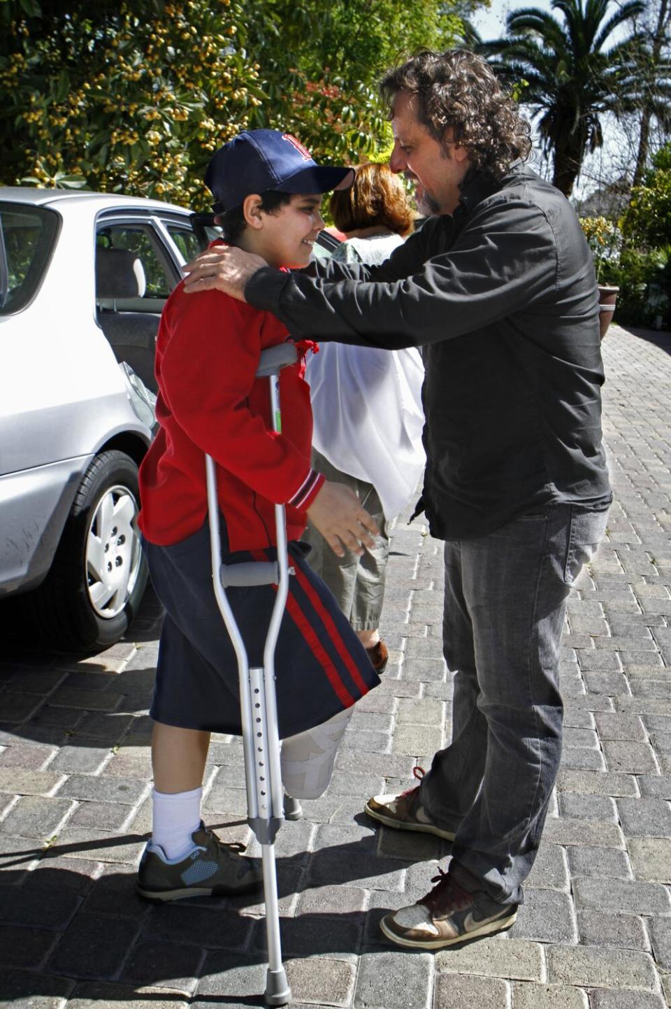 Host parent George Abuhamad welcomes 11-yr-old Abdullah Alathamna to his home in Yorba Linda in 2010