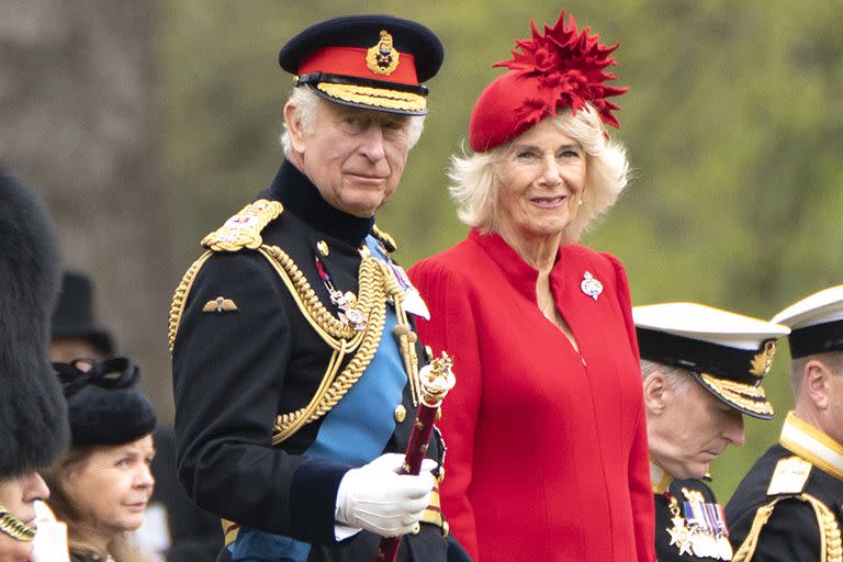 Britain's King Charles III and Camilla, the Queen Consort attend a ceremony to present new Standards and Colours to the Royal Navy, the Life Guards of the Household Cavalry Mounted Regiment, The King's Company of the Grenadier Guards and The King's Colour Squadron of the Royal Air Force at Buckingham Palace in London, Thursday April 27, 2023. (Stefan Rousseau, Pool Photo via AP)