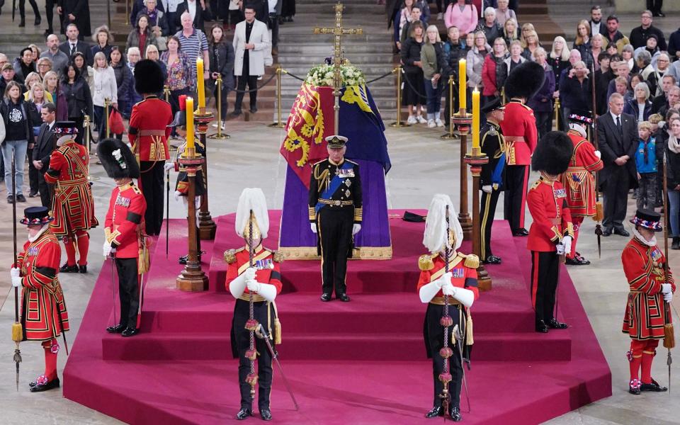King Charles III, the Princess Royal, the Duke of York and the Earl of Wessex hold a vigil beside the coffin of Queen Elizabeth II as it lies in state on the catafalque in Westminster Hall - Reuters