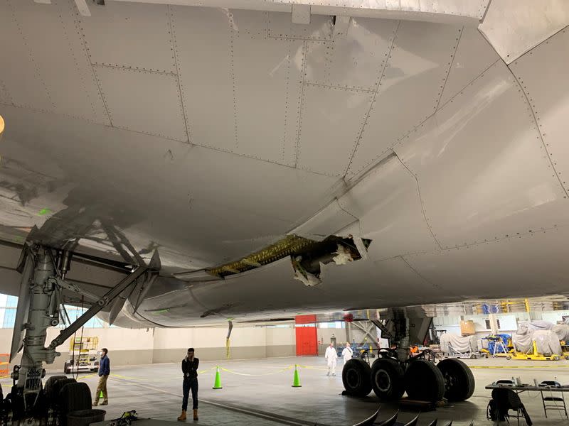 Damage to the wing and the body fairing of United Airlines flight 328 is seen following a February 20 engine failure incident