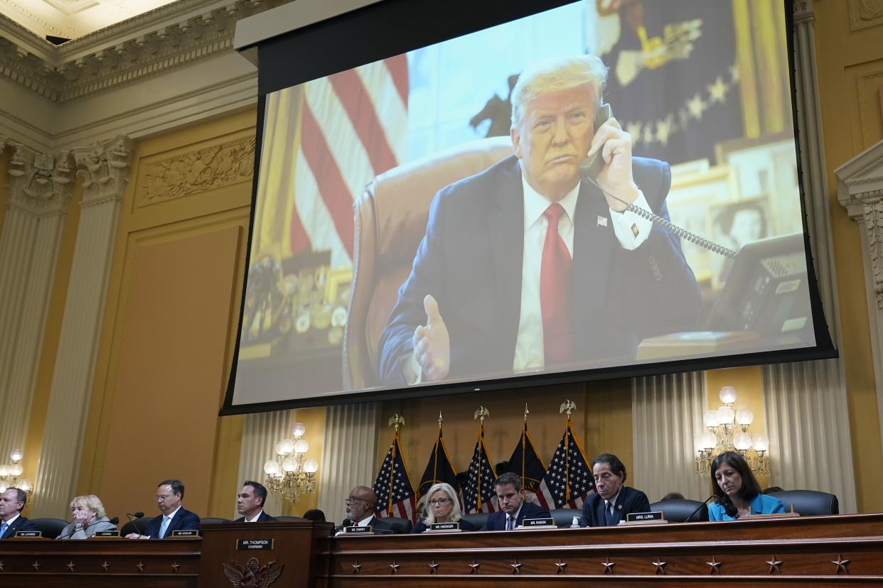 A video exhibit plays as the House select committee investigating the Jan. 6, 2021, attack on the Capitol holds a hearing at the Capitol in Washington, Thursday, June 16, 2022. 