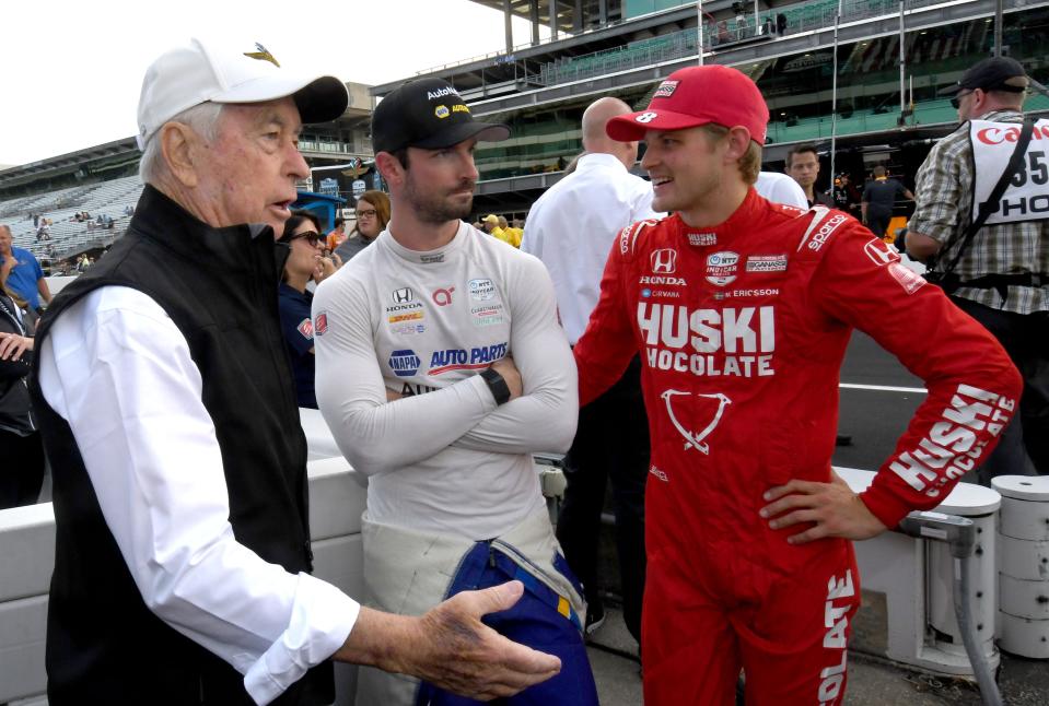Roger Penske (from left) talks with Andretti Autosport driver Alexander Rossi (27) and Chip Ganassi Racing driver Marcus Ericsson (8) on Saturday, July 30, 2022, before a doubleheader race day at Indianapolis Motor Speedway.