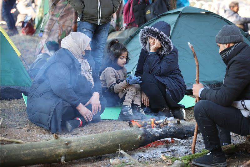 Migrants gather on the Belarusian-Polish border