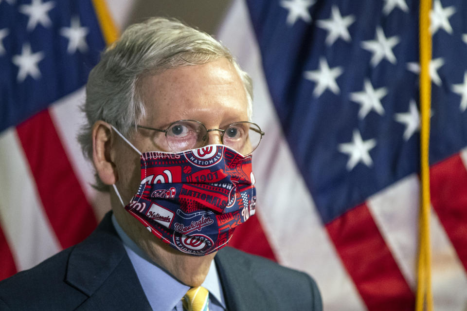 FILE - In this June 30, 2020, file photo Senate Majority Leader Mitch McConnell, R-Ky., listens to questions during a news conference following a GOP policy meeting on Capitol Hill in Washington. McConnell is emerging the GOP's mask spokesman, the highest ranking Republican in Congress proselytizing about the importance of wearing a face covering during the pandemic. (AP Photo/Manuel Balce Ceneta, File)