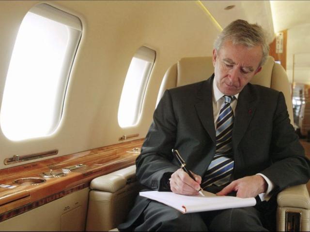 LVMH CEO Bernard Arnault on board his private jet between Beijing and Shanghai. in Shanghai, China on October 11, 2004.