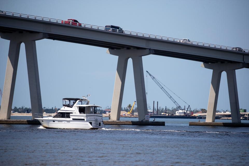 Work continues on the Sanibel Causeway on Thursday, Sept 7, 2023. Crews are paving new lanes as cranes and backhoes work in other areas to improve the roadway.