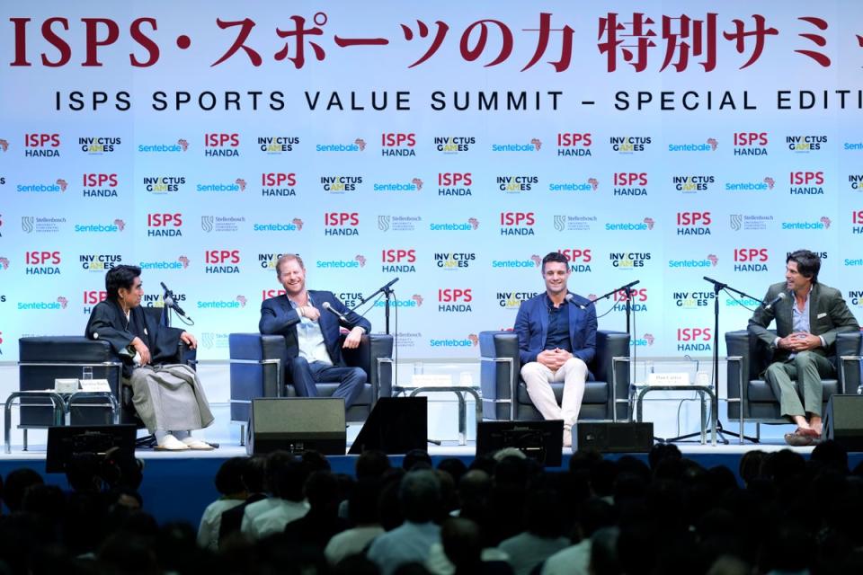 Haruhisa Handa, from left, CEO of the International Sports Promotion Society (ISPS), Britain's Prince Harry, former All Blacks player Dan Carter and Argentine polo player Ignacio 