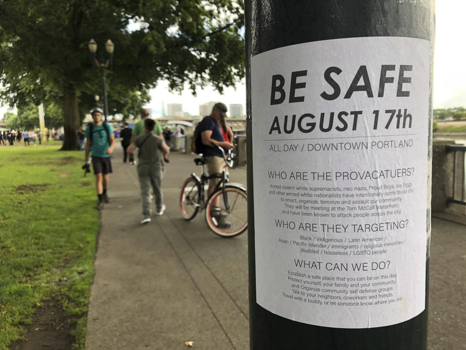 A posted sign reads &quot;Be Safe. August 17th&quot; is posted in Portland, Ore., Saturday, Aug. 17, 2019.  Right-wing groups and counterprotesters gathered in downtown Portland, Oregon, on Saturday and authorities set up concrete barriers and closed streets in an effort to contain the groups. (AP Photo/Gillian Flaccus)