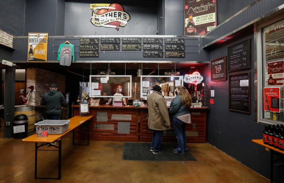Customers order a beer inside the taproom at Mother's Brewing Company on Saturday, January 9, 2021.