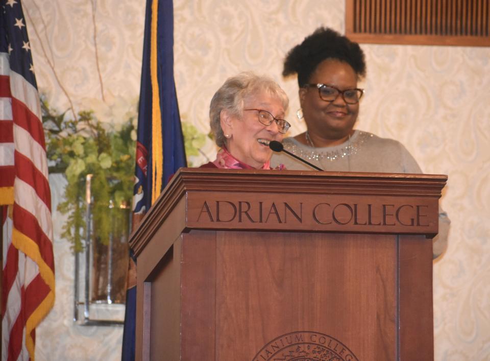 Sister Patricia Harvat, O.P., a member of the Adrian Dominican Sisters, standing at the podium, was one of two community members to earn the 2024 Community Service Award Monday, Jan. 15, 2024, during Adrian's annual Martin Luther King Jr. Day Celebration. The other awardee was lifelong Adrian resident Rudy Flores.