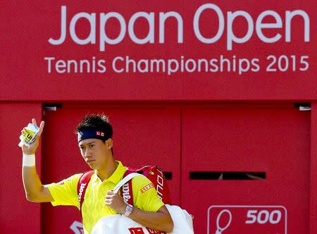 Japan's Kei Nishikori arrives at the court to play Marin Cilic of Croatia in their men's singles tennis match at the Japan Open championships in Tokyo October 9, 2015. REUTERS/Thomas Peter