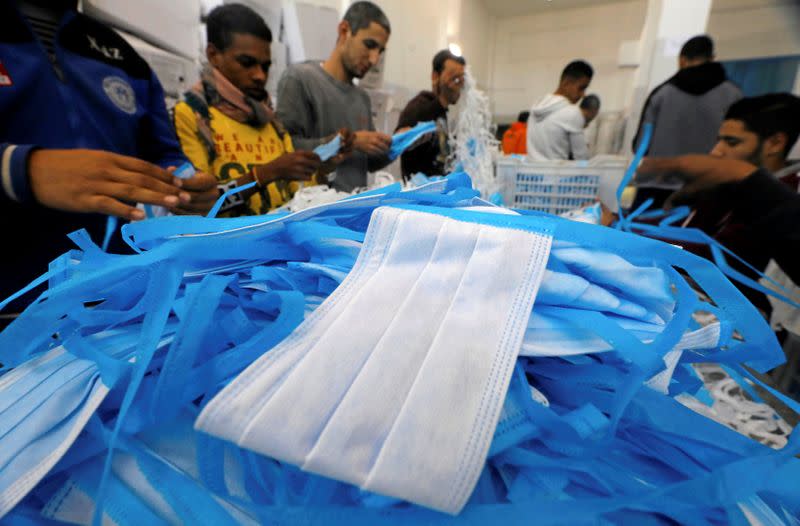 Workers are seen in a factory that produces sterilised surgical equipment and medical clothings in Egypt