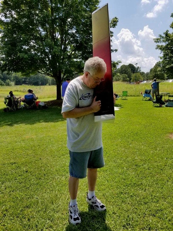 Dan Kaminsky, TriState Astronomers' outreach coordinator, using a cardboard shipping tube as a pinhole projector during the Aug. 21, 2017, eclipse while in the path of totality in Greenwood, S.C.