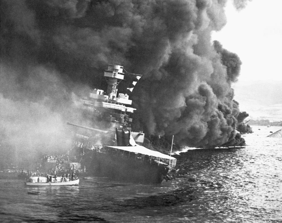 Crew members from the USS California abandon their burning ship after the Japanese attack on Pearl Harbor. December 7, 1941. / Credit: CORBIS/Corbis via Getty Images