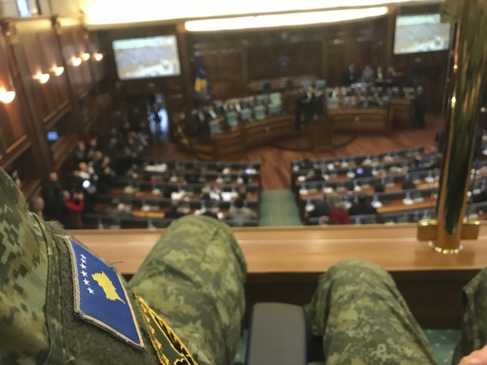 The Kosovo national flag insignia is worn on the uniform of a Kosovo Security Force member attending a parliamentary session to approve the formation of an army, in capital Pristina, Kosovo on Friday, Dec. 14, 2018. Kosovo's parliament convened on Friday to approve the formation of an army, a move that has angered Serbia which says it would threaten peace in the war-scarred region. (AP Photo/Florent Bajrami)