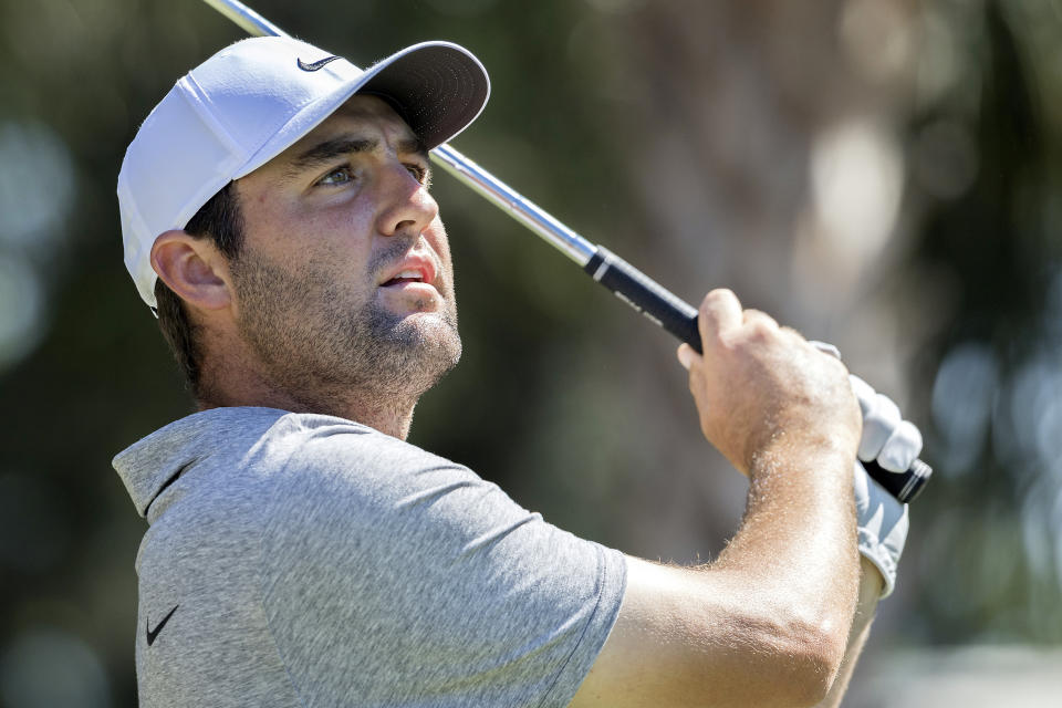 Scottie Scheffler watches his drive off the 11th tee during the third round of the RBC Heritage golf tournament, Saturday, April 15, 2023, in Hilton Head Island, S.C. (AP Photo/Stephen B. Morton)