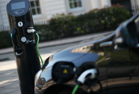 A Volvo hybrid car is seen connected to a charging point in London, Britain September 1, 2017. REUTERS/Hannah McKay