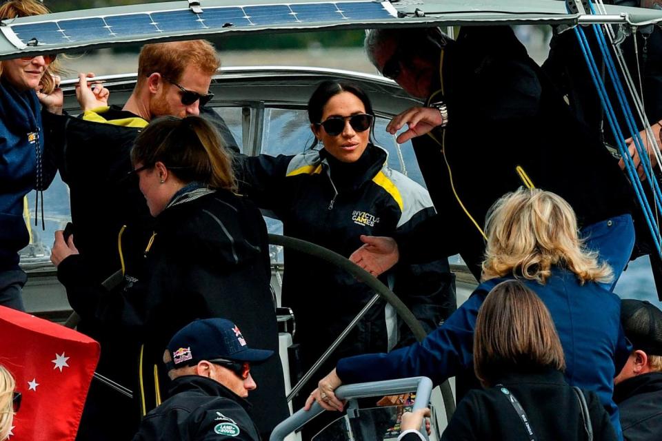 Harry and Meghan sail on Sydney Harbour on the first day of the Invictus Games (AFP/Getty Images)