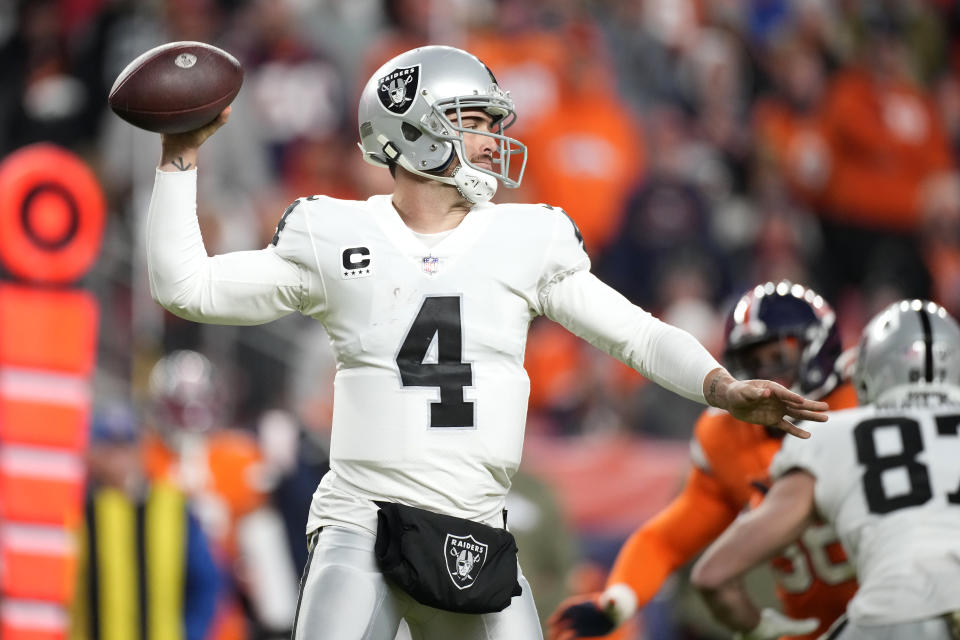 Las Vegas Raiders quarterback Derek Carr (4) passes against the Denver Broncos during the second half of an NFL football game in Denver, Sunday, Nov. 20, 2022. (AP Photo/David Zalubowski)