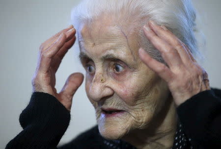 Silvard Atajyan, 103, gestures during an interview with Reuters at home in Yerevan, April 20, 2015. REUTERS/David Mdzinarishvili