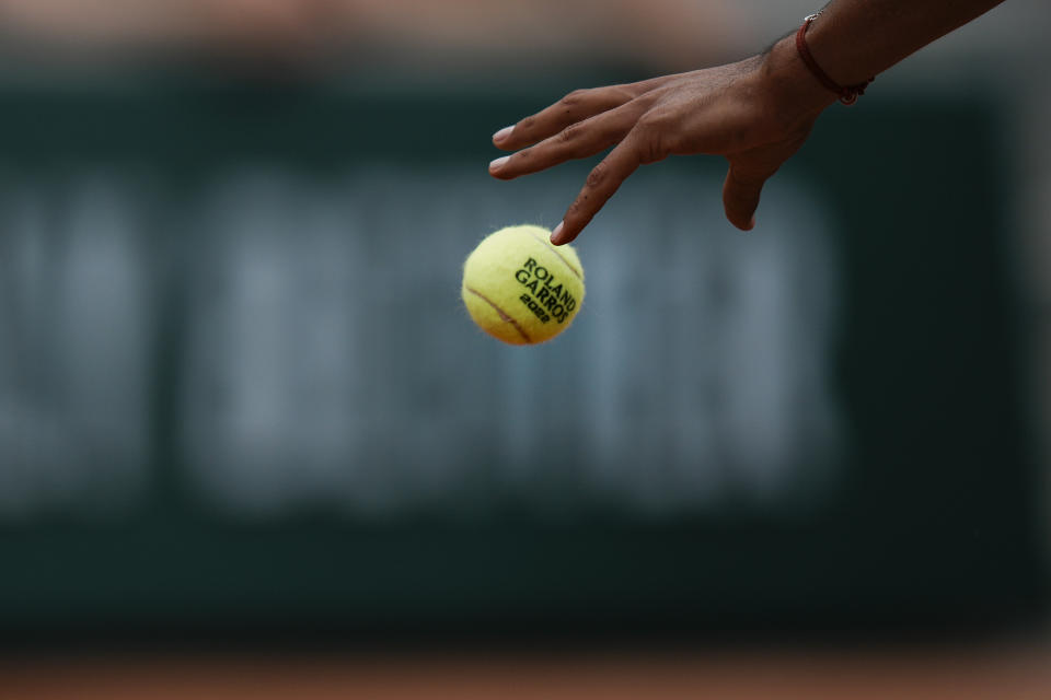 A player prepares to serve during first round matches at the French Open tennis tournament in Roland Garros stadium in Paris, France, Sunday, May 22, 2022. (AP Photo/Thibault Camus)