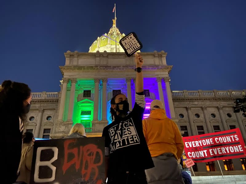 Activists rally at the Pennsylvania State Capitol Building to protest attempts to halt the counting of ballots cast in the state for the 2020 presidential election