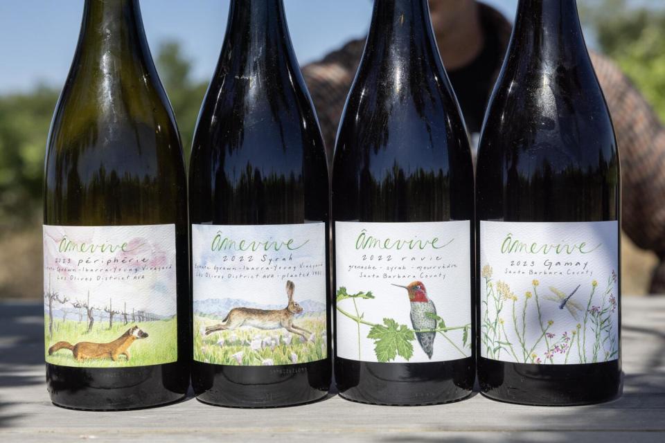 Wine bottles produced by Âmevive vineyard.