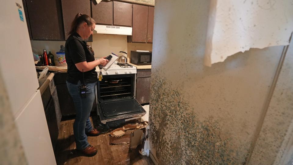 City of Columbus property maintenance supervisor Deborah Coleman calls in an emergency housing order for Aydarus Farah, after discovering the condition of his townhouse at the Carriage House apartments on the Northeast Side.